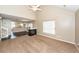 Living room featuring an open layout with views of the fireplace, dining area, and staircase at 5215 Chicory Ln, North Charleston, SC 29420