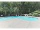 Community pool featuring ample lounge chairs and mature landscaping at 5215 Chicory Ln, North Charleston, SC 29420