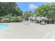 Community pool with chairs, tables and mature landscaping at 5215 Chicory Ln, North Charleston, SC 29420