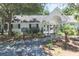 Charming pool house featuring a gated entrance and lush landscaping at 5215 Chicory Ln, North Charleston, SC 29420