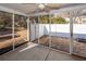 The screened porch features a ceiling fan and access to the fenced back yard at 5215 Chicory Ln, North Charleston, SC 29420