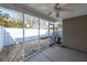 The screened porch features a ceiling fan, brick pavers and access to the fenced back yard at 5215 Chicory Ln, North Charleston, SC 29420