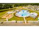 Aerial view of community pool, splash pad, playground and surrounding new construction homes at 708 Long Bluff Rd, Summerville, SC 29486