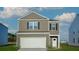 Charming two-story home with attached garage and manicured lawn in a desirable neighborhood at 708 Long Bluff Rd, Summerville, SC 29486