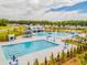 Community pool features spiral water slide and a view of the neighborhood homes at 708 Long Bluff Rd, Summerville, SC 29486