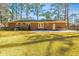 Charming brick home with a spacious backyard, patio, and well-kept lawn, ideal for outdoor activities and gatherings at 715 Old Golf Rd, Summerville, SC 29483