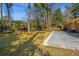 Expansive backyard featuring lush green lawn and a concrete patio, perfect for outdoor entertaining and relaxation at 715 Old Golf Rd, Summerville, SC 29483