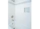 Clean white bathroom tub and shower area, accented with stylish blue mosaic tile border at 715 Old Golf Rd, Summerville, SC 29483
