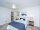 Bright bedroom featuring a ceiling fan, carpet, and a bed with white and blue linens at 715 Old Golf Rd, Summerville, SC 29483