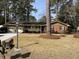 Charming brick home featuring a well-manicured lawn, attached garage, and welcoming front porch, perfect for enjoying the outdoors at 715 Old Golf Rd, Summerville, SC 29483