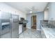 Bright kitchen with stainless steel appliances, granite countertops, and tile flooring at 715 Old Golf Rd, Summerville, SC 29483