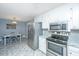 Modern kitchen featuring stainless steel appliances, granite countertops, and tile flooring at 715 Old Golf Rd, Summerville, SC 29483