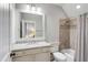 Neutral bathroom featuring a large framed mirror, granite countertop, and decorative shower curtain at 720 Island Park Dr # 107, Charleston, SC 29492