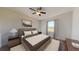 Relaxing bedroom features a ceiling fan, neutral color palette, and bedside lamps at 728 Pisces Ln, Summerville, SC 29486