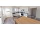 Bright kitchen features stainless steel appliances, granite countertops, and white cabinets at 728 Pisces Ln, Summerville, SC 29486