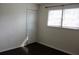 Bright bedroom with closet, featuring dark hardwood floors and plenty of natural light at 7645 Knollwood Dr, North Charleston, SC 29418