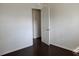 Cozy bedroom with hardwood floors and an open doorway, offering a glimpse into another room at 7645 Knollwood Dr, North Charleston, SC 29418