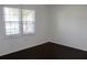 Bedroom featuring a double window and dark hardwood floors at 7645 Knollwood Dr, North Charleston, SC 29418