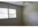 Bedroom featuring a ceiling fan, double window, and neutral-toned walls at 7645 Knollwood Dr, North Charleston, SC 29418
