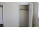 A closet with an open louvered door features a rod and shelf for easy storage at 7645 Knollwood Dr, North Charleston, SC 29418