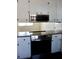 Modern kitchen with white cabinets, stainless steel appliances, and countertops at 7645 Knollwood Dr, North Charleston, SC 29418
