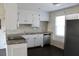Efficient kitchen with stainless steel appliances, mosaic backsplash and white cabinetry at 7645 Knollwood Dr, North Charleston, SC 29418
