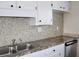 Beautiful backsplash and stainless steel appliances in this kitchen at 7645 Knollwood Dr, North Charleston, SC 29418