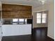 Open-concept living room featuring a kitchen with updated backsplash at 7645 Knollwood Dr, North Charleston, SC 29418