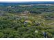 Aerial view of a secluded home surrounded by lush trees and waterways at 8869 Marsh Aire Ln, Edisto Island, SC 29438
