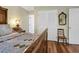 Inviting bedroom showcases an antique bed frame, plush bedding and traditional decor elements at 8869 Marsh Aire Ln, Edisto Island, SC 29438
