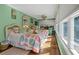 Cozy bedroom featuring two wicker beds and lots of natural light at 8869 Marsh Aire Ln, Edisto Island, SC 29438