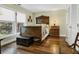 Charming bedroom with dark wood flooring and ornate wooden bed frame, next to sunlit windows at 8869 Marsh Aire Ln, Edisto Island, SC 29438