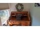 A vintage roll top desk sits by the window at 8869 Marsh Aire Ln, Edisto Island, SC 29438