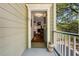 Inviting entryway with an open view to the living room's fireplace, showcasing the home's interior charm and character at 8869 Marsh Aire Ln, Edisto Island, SC 29438
