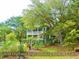 Charming custom Charleston home with marsh views surrounded by lush greenery on a spacious 1.3-acre lot at 8869 Marsh Aire Ln, Edisto Island, SC 29438