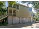 Charming multi-story home with stairs leading to the backyard and multiple balconies at 8869 Marsh Aire Ln, Edisto Island, SC 29438