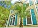 Charming two-story home with decorative shutters, enhancing curb appeal and coastal style at 8869 Marsh Aire Ln, Edisto Island, SC 29438