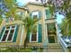 Eye-catching front exterior featuring unique shutters and hardiplank siding adding curb appeal to this charming property at 8869 Marsh Aire Ln, Edisto Island, SC 29438