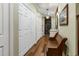 Hallway with storage closets, bench seating, and decorative painting at 8869 Marsh Aire Ln, Edisto Island, SC 29438