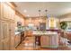 Spacious kitchen with custom cabinets, granite countertops, stainless appliances, and an island at 8869 Marsh Aire Ln, Edisto Island, SC 29438