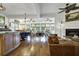 Open concept living room and dining area with ample natural light at 8869 Marsh Aire Ln, Edisto Island, SC 29438