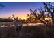 Picturesque marsh view at sunset, showcasing the natural beauty of the surrounding landscape with the sun setting at 8869 Marsh Aire Ln, Edisto Island, SC 29438