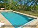 Pool featuring an electric cover for easy maintenance and enjoyment of outdoor living at 8869 Marsh Aire Ln, Edisto Island, SC 29438