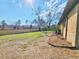 Backyard featuring a green lawn, a new, wood fence, brick walls, and mature shade trees at 9 Grover Ln, Goose Creek, SC 29445