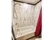 Bathroom with a white bathtub, black trimmed tile walls, a red shower curtain, and a chrome shower head at 9 Grover Ln, Goose Creek, SC 29445