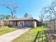 Charming single story home with a brick facade, well-manicured lawn, and an attached one car garage at 9 Grover Ln, Goose Creek, SC 29445