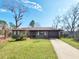 Charming single story home with a brick facade, well-manicured lawn, and an attached one car garage at 9 Grover Ln, Goose Creek, SC 29445