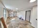 Spacious garage featuring a gray painted floor, white walls, a utility sink, and overhead storage struts at 9 Grover Ln, Goose Creek, SC 29445
