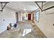 Spacious garage featuring a gray painted floor, white walls, a utility sink, and overhead storage struts at 9 Grover Ln, Goose Creek, SC 29445