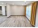 Bright living room features wood flooring, neutral walls, large windows, and plenty of space at 9 Grover Ln, Goose Creek, SC 29445